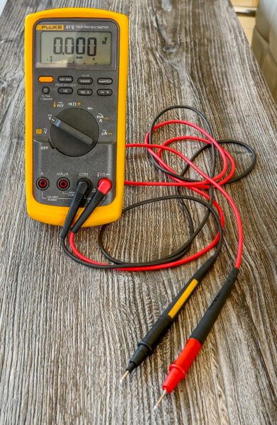 How to use a multimeter for blown car fuses?